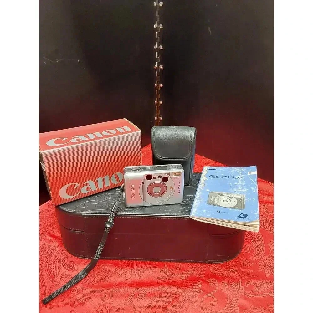Camera by Canon model lX240 ELPH JR. Includes soft case working Film Camera
